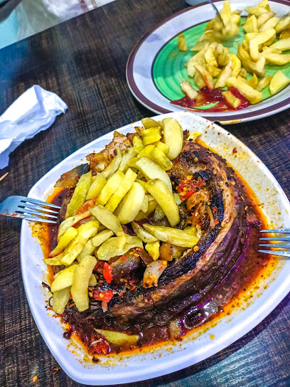 Alh Isa Cosmopolitan Suya Gallery II restaurant serving Restaurant