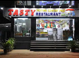 Tasty Restaurant restaurant photo 3 showing dining area and food